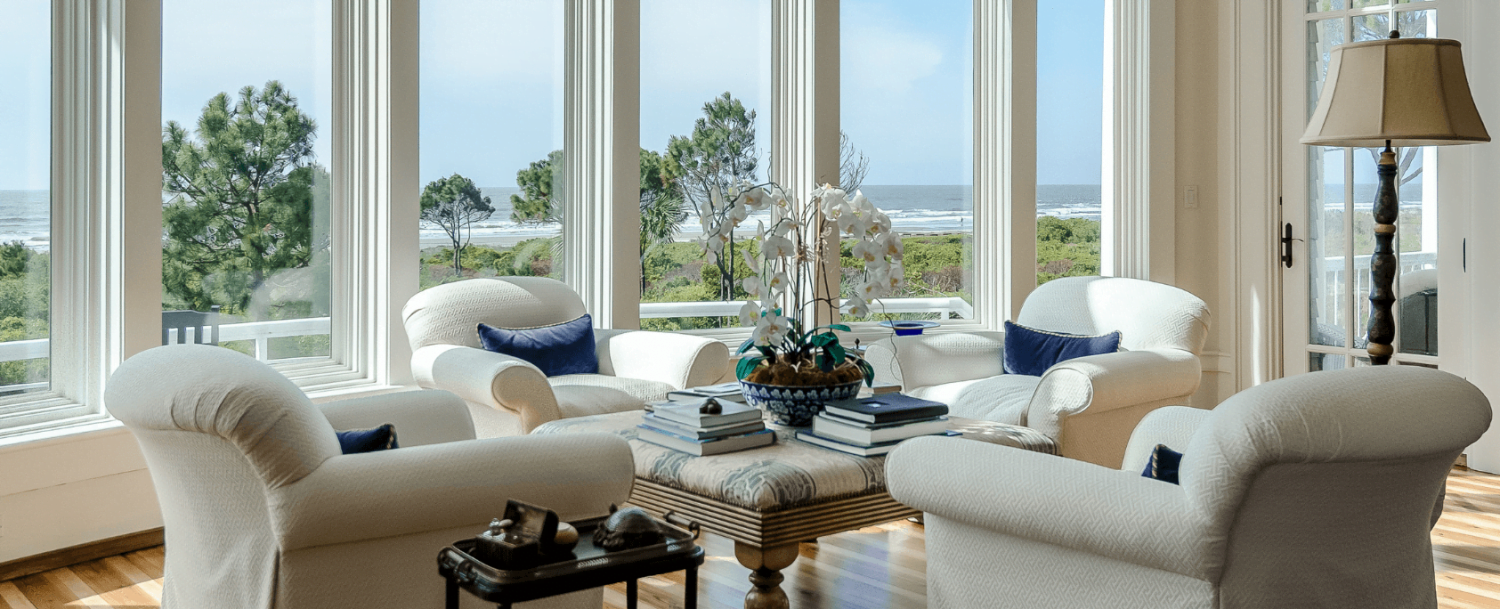 living room in a beautiful vacation home managed by Pam Harrington Exclusives: how to calculate your vacation rental income.