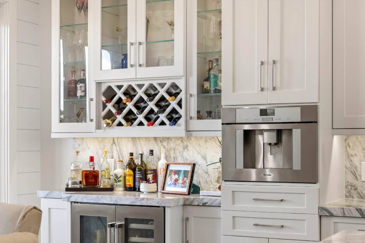 Kitchen bar area with built-in wine rack, wine cooler, and Thermador built-in coffee system at 6411 China Back Lane, Meggett SC — Archfield Plantation