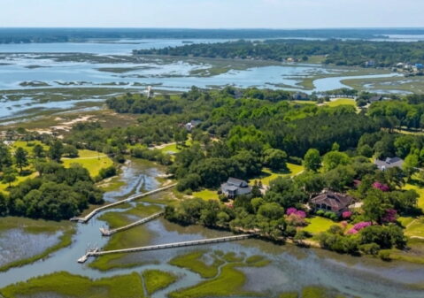 Aerial view of private dock and boardwalk extending through Lowcountry marsh on Oyster House Creek at 6411 China Back Lane, Meggett SC — Archfield Plantation
