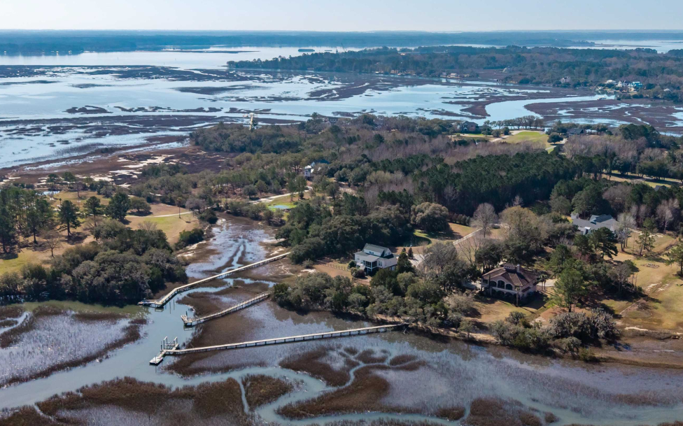 Aerial view of private dock and boardwalk extending through Lowcountry marsh on Oyster House Creek at 6411 China Back Lane, Meggett SC — Archfield Plantation