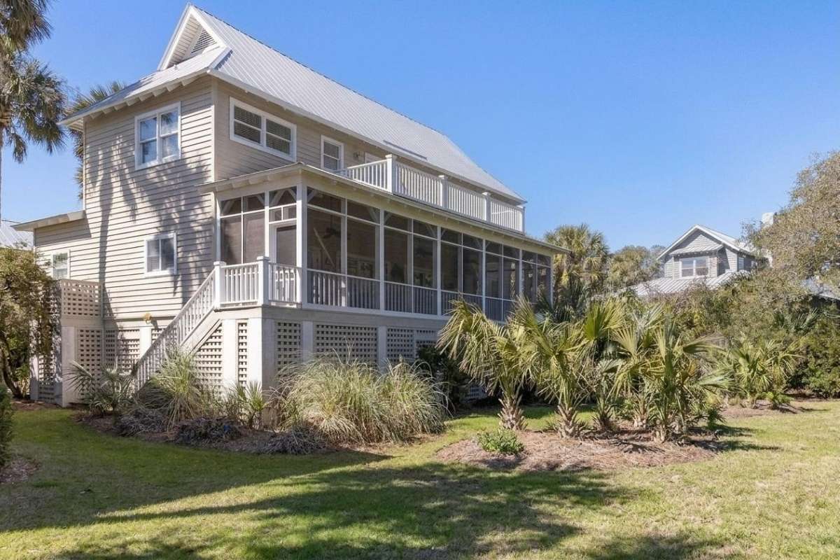 Classic three-story beach house with screened porch and metal roof at Atlantic Beach on Kiawah Island