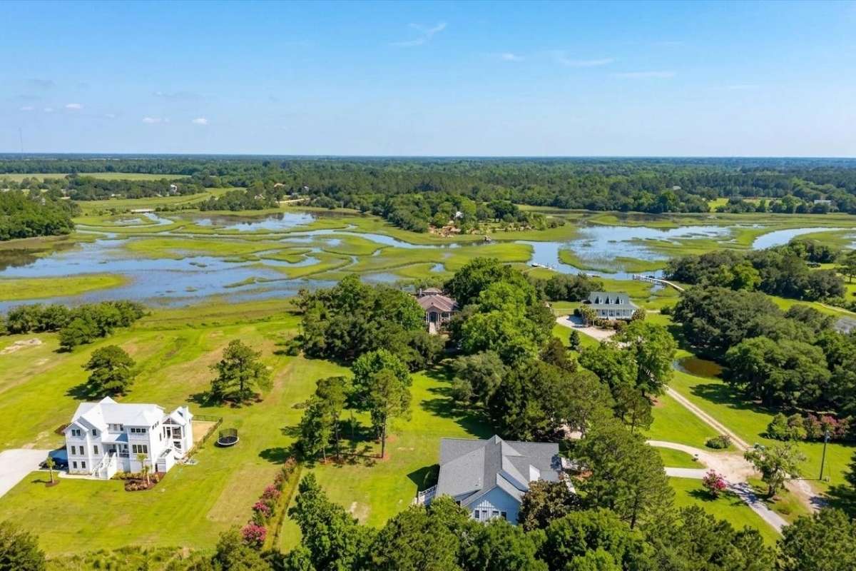 Aerial view of 6411 China Back Lane, Meggett SC showing private dock on Oyster House Creek with tidal marsh and ICW access — Archfield Plantation