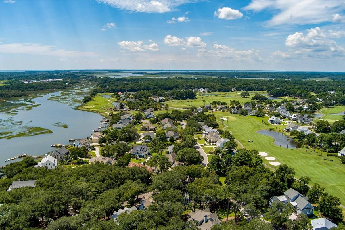 Aerial view of Kiawah River Estates showing tidal creek, marsh, homes, and Oak Point golf course on Johns Island SC