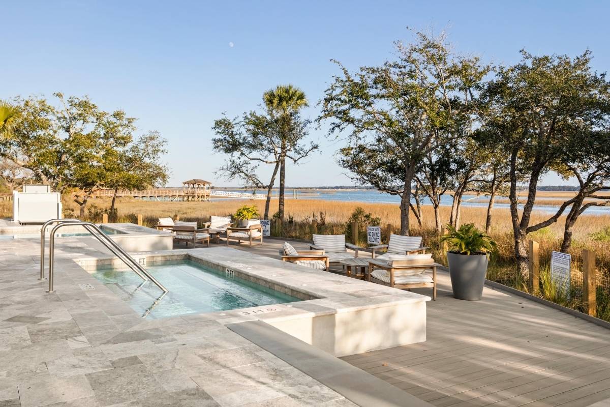 Spring House community pool and lounge seating with marsh and tidal water views at Kiawah River, Johns Island SC