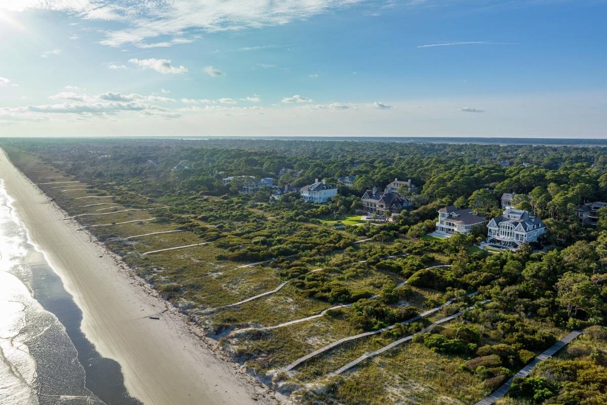Aerial view of Vanderhorst Plantation beachfront homes along Kiawah Island's Atlantic Ocean shoreline with dune boardwalk access, Kiawah Island SC